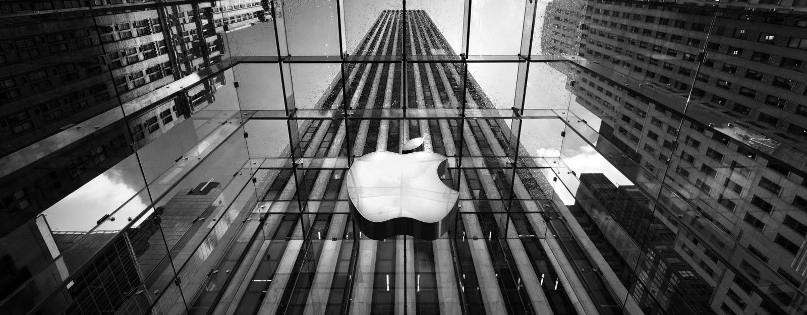 apple_sign_on_building_in_black_and_white-wide